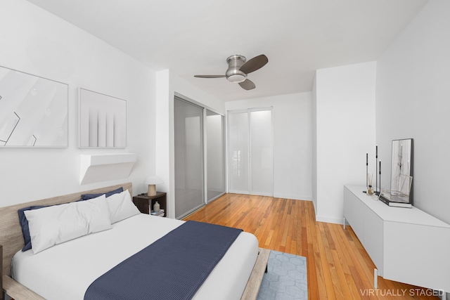 211 Thompson St Unit Lb, New York City, NY 10012 - bedroom with baseboards, light wood-type flooring, a ceiling fan, and a closet