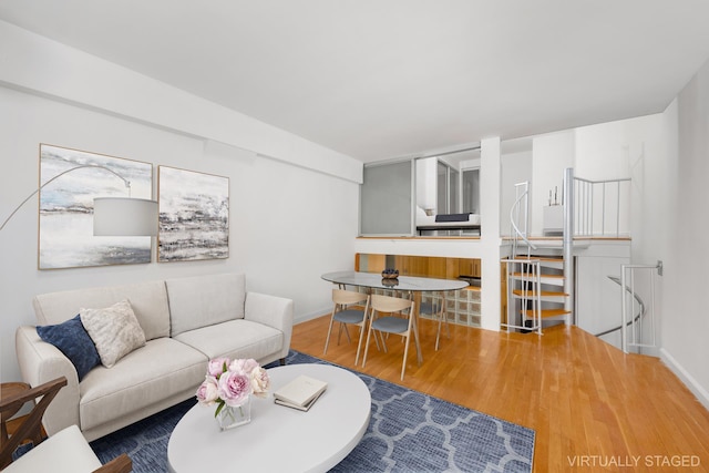 211 Thompson St Unit Lb, New York City, NY 10012 - living room featuring baseboards and wood finished floors
