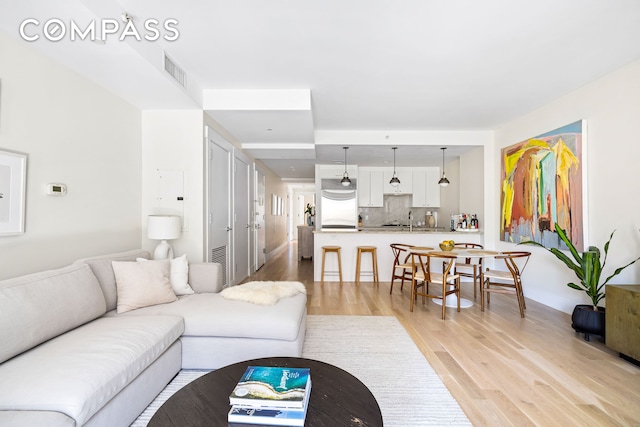 living room featuring light wood-style floors