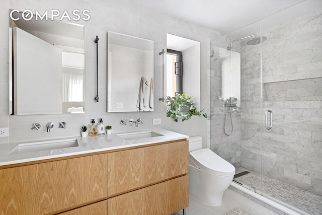 full bath featuring a stall shower and a sink