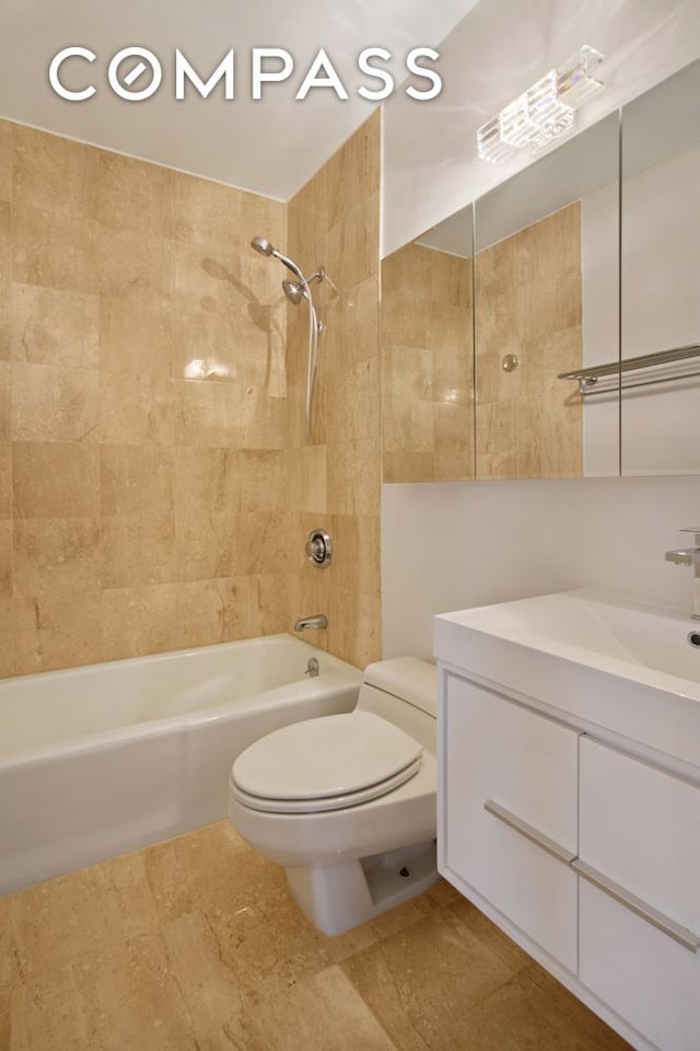 393 W 49th St Unit 6G, New York City, NY 10019 - bathroom featuring toilet, shower / tub combination, and vanity