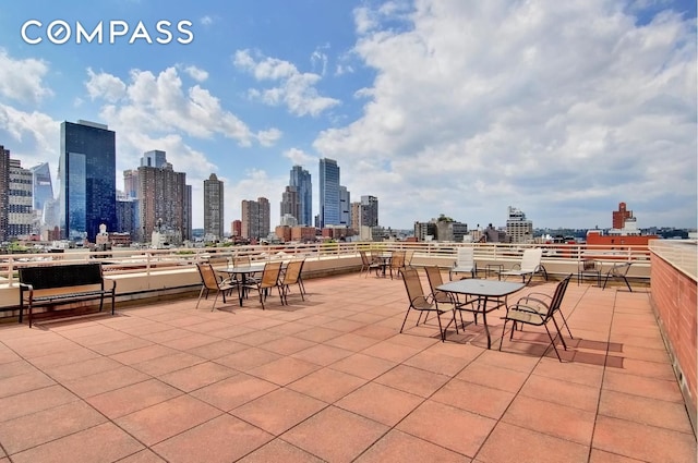 393 W 49th St Unit 6G, New York City, NY 10019 - view of patio featuring a skyline view