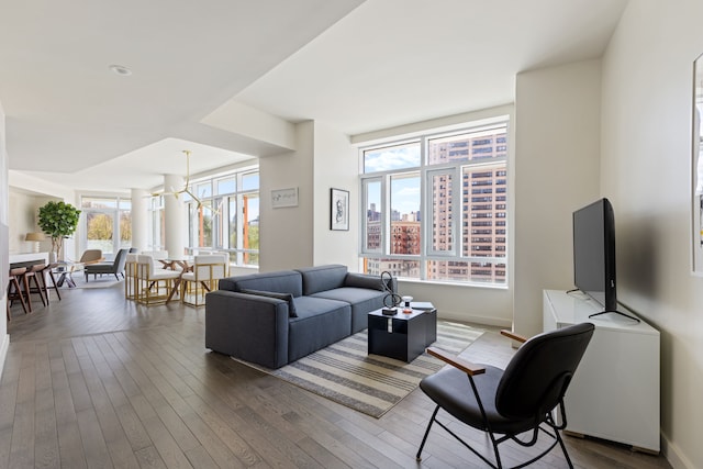 living area featuring baseboards and wood finished floors
