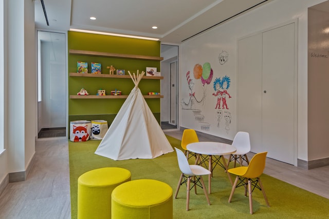 285 W 110th St Unit 5G, New York City, NY 10026 - playroom with wood finished floors, recessed lighting, and baseboards