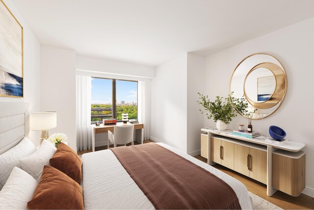 301 W 57th St Unit 14C, New York City, NY 10019 - bedroom with baseboards and light wood-type flooring