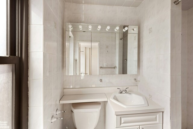 165 W End Ave Unit 17M, New York City, NY 10023 - bathroom with tile walls, vanity, tasteful backsplash, and a shower