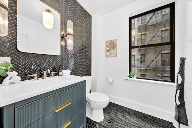 bathroom featuring vanity and toilet