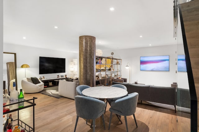 dining area featuring recessed lighting and wood-type flooring