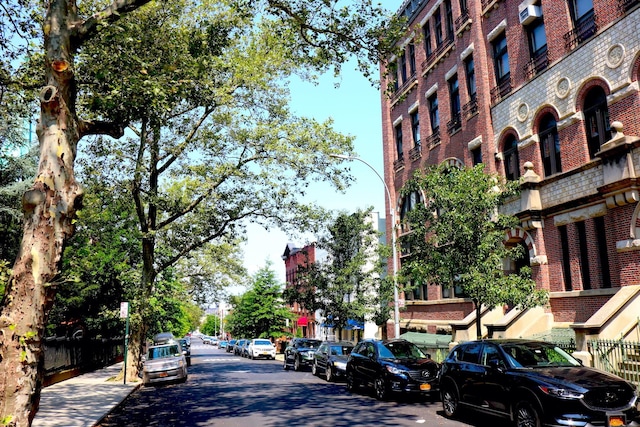 259 21st St Unit 1-C, New York City, NY 11215 - view of asphalt street with sidewalks, street lights, and curbs