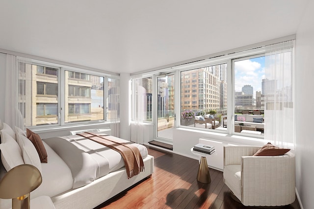 80 Riverside Blvd Unit 8-E, New York City, NY 10069 - bedroom with hardwood / wood-style floors, a city view, access to exterior, and baseboards