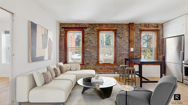 467 Pacific St Unit 18, New York City, NY 11217 - living area featuring brick wall, light wood-style floors, and cooling unit