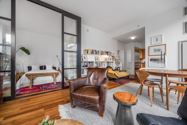 living area featuring wood finished floors and plenty of natural light
