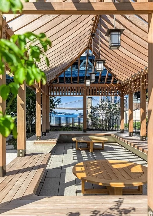 view of community featuring a pergola and a wooden deck
