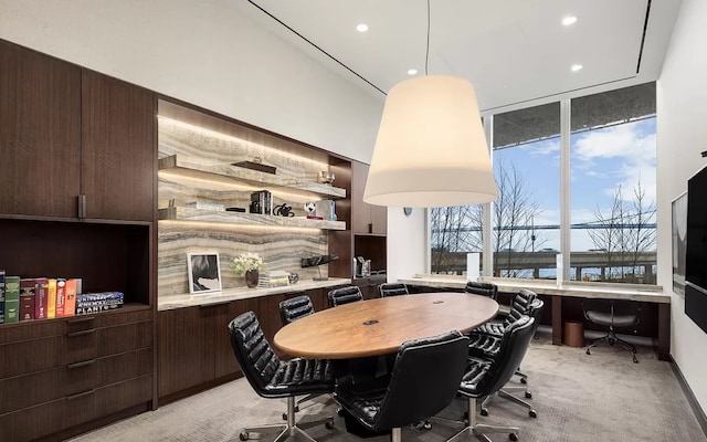 dining space featuring recessed lighting and light colored carpet