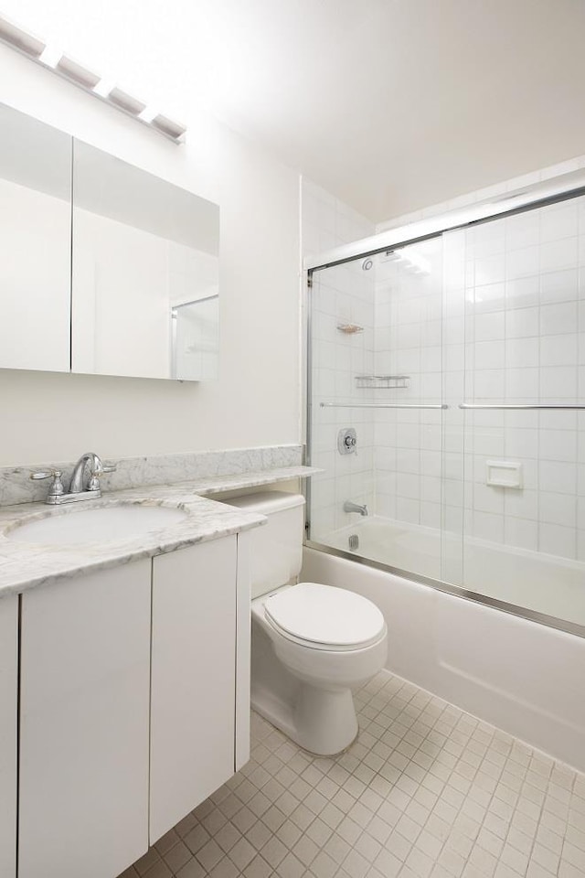 150 W 51st St Unit 1730, New York City, NY 10019 - full bath with vanity, tile patterned flooring, toilet, and enclosed tub / shower combo