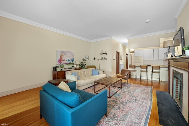489 W End Ave, New York City, NY 10024 - living room featuring baseboards, ornamental molding, and wood finished floors