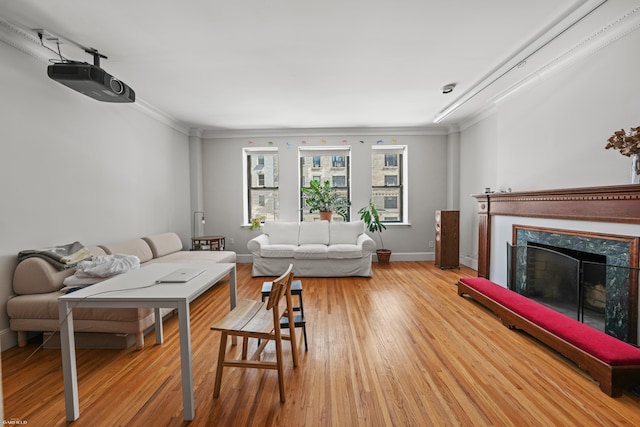 489 W End Ave, New York City, NY 10024 - living room with baseboards, a fireplace, light wood-style floors, and ornamental molding