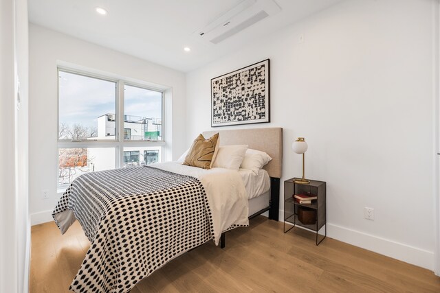 87A Cooper St Unit 4-A, New York City, NY 11207 - bedroom with wood finished floors, baseboards, and recessed lighting