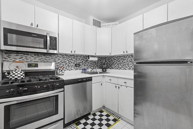 370 E 76th St Unit B-507, New York City, NY 10021 - kitchen featuring stainless steel appliances, light countertops, a sink, and backsplash