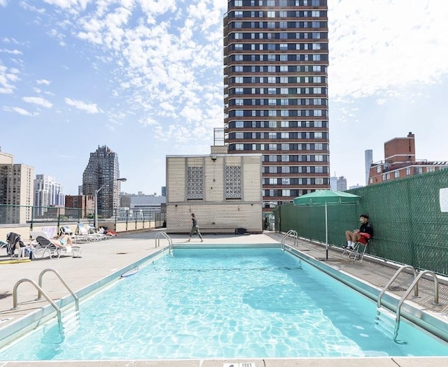 370 E 76th St Unit B-507, New York City, NY 10021 - community pool featuring a city view