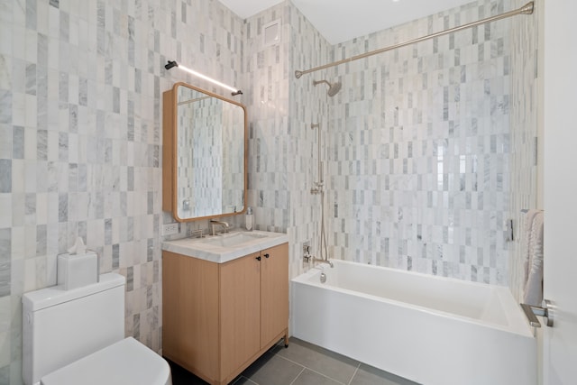 180 Front St Unit 17-E, New York City, NY 11201 - bathroom with tile walls, tile patterned floors, bathing tub / shower combination, toilet, and vanity