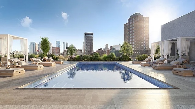 180 Front St Unit 17-E, New York City, NY 11201 - community pool with a skyline view and a patio area