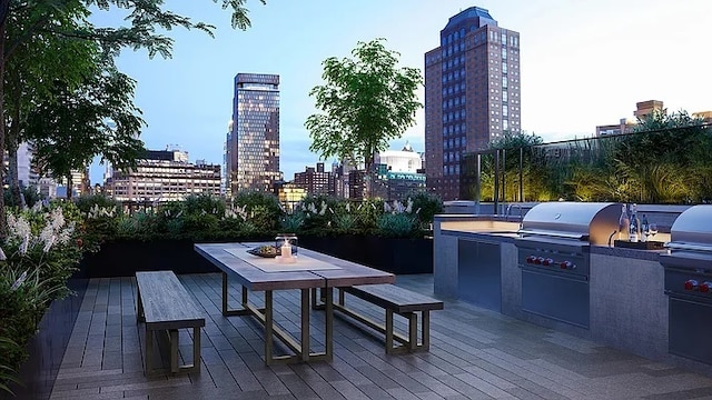 180 Front St Unit 17-E, New York City, NY 11201 - view of patio with a skyline view, exterior kitchen, and grilling area