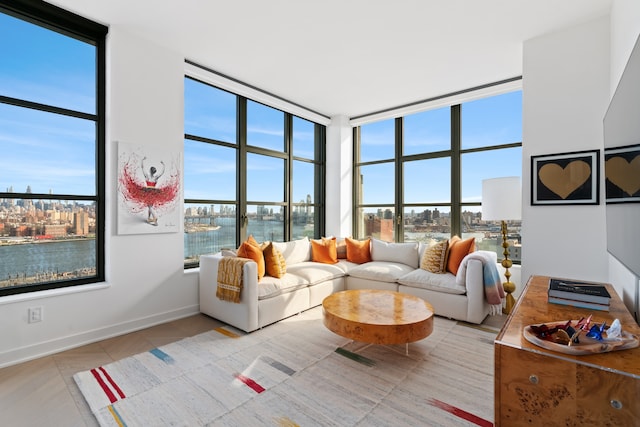 180 Front St Unit 17-E, New York City, NY 11201 - living area with expansive windows, light tile patterned flooring, and a water view