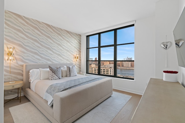 180 Front St Unit 17-E, New York City, NY 11201 - bedroom with wood finished floors and baseboards
