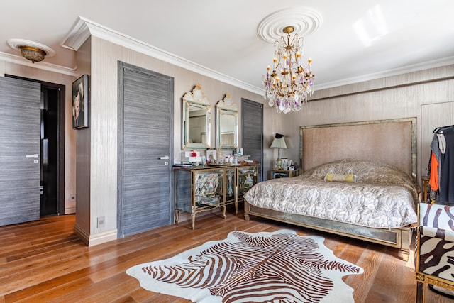 58 W 58th St Unit 30-E, New York City, NY 10019 - bedroom featuring a chandelier, hardwood / wood-style floors, and crown molding