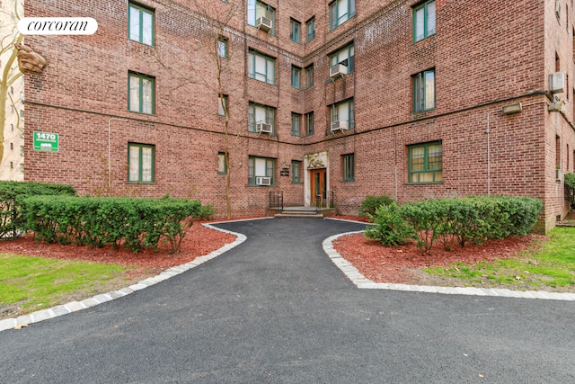 view of building exterior with cooling unit