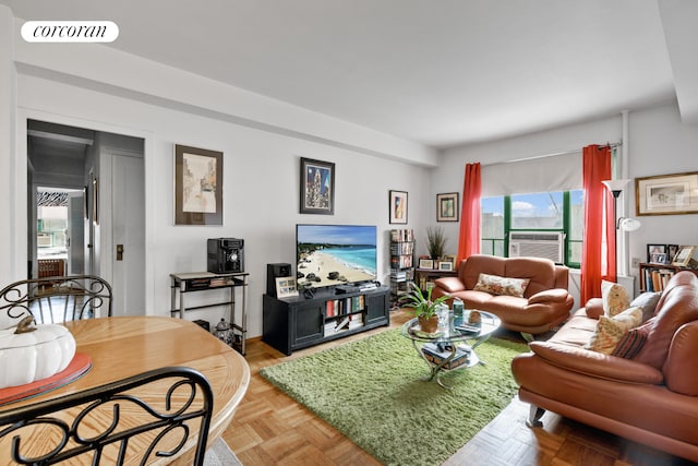 living room with visible vents, cooling unit, and a healthy amount of sunlight