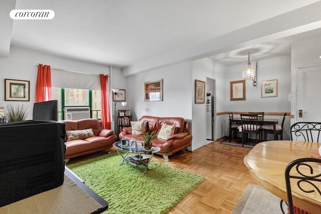 living room with visible vents and cooling unit