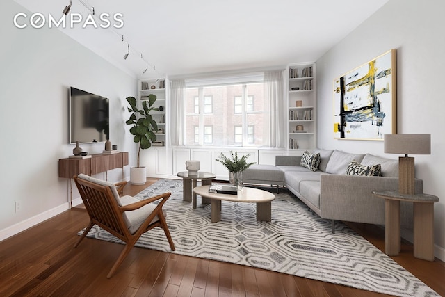 137 E 36th St Unit 8H, New York City, NY 10016 - living area featuring hardwood / wood-style flooring, baseboards, and built in shelves