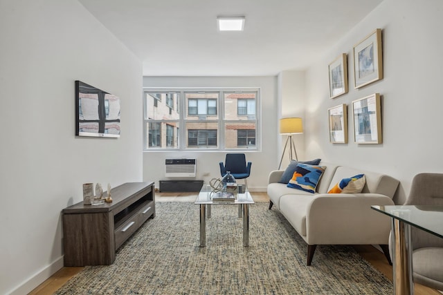 340 E 80th St Unit 9A, New York City, NY 10021 - living room with wood finished floors, baseboards, and heating unit