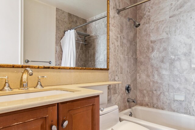 bathroom with toilet, shower / bath combo, and vanity