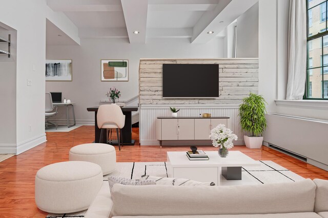 45-02 Ditmars Blvd Unit 231, New York City, NY 11105 - living room with recessed lighting, light wood finished floors, beamed ceiling, a desk, and baseboards
