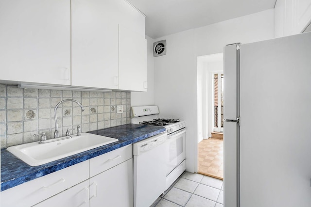 2727 Palisade Ave Unit 14-A, New York City, NY 10463 - kitchen with white appliances, a sink, white cabinets, and tasteful backsplash