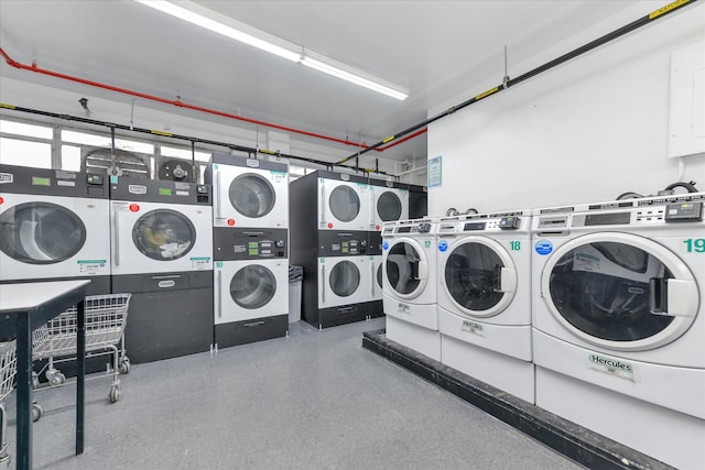 2727 Palisade Ave Unit 14-A, New York City, NY 10463 - community laundry featuring stacked washer / dryer, washer and dryer, and a garage