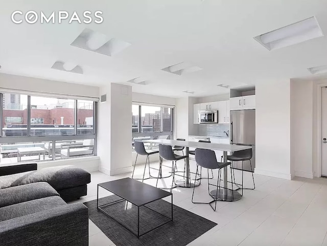 171 W 131st St Unit Ph4, New York City, NY 10027 - living room with baseboards
