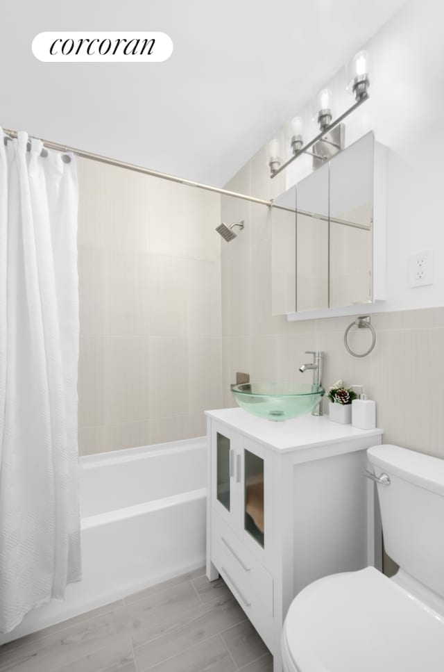 330 Lenox Rd Unit 6F, New York City, NY 11226 - bathroom featuring toilet, shower / bath combination with curtain, and vanity