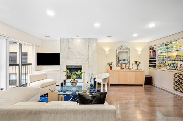 7 E 35th St Unit 14A, New York City, NY 10016 - living area featuring wood finished floors, recessed lighting, and a high end fireplace