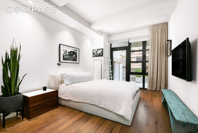 bedroom featuring wood finished floors, recessed lighting, and access to exterior