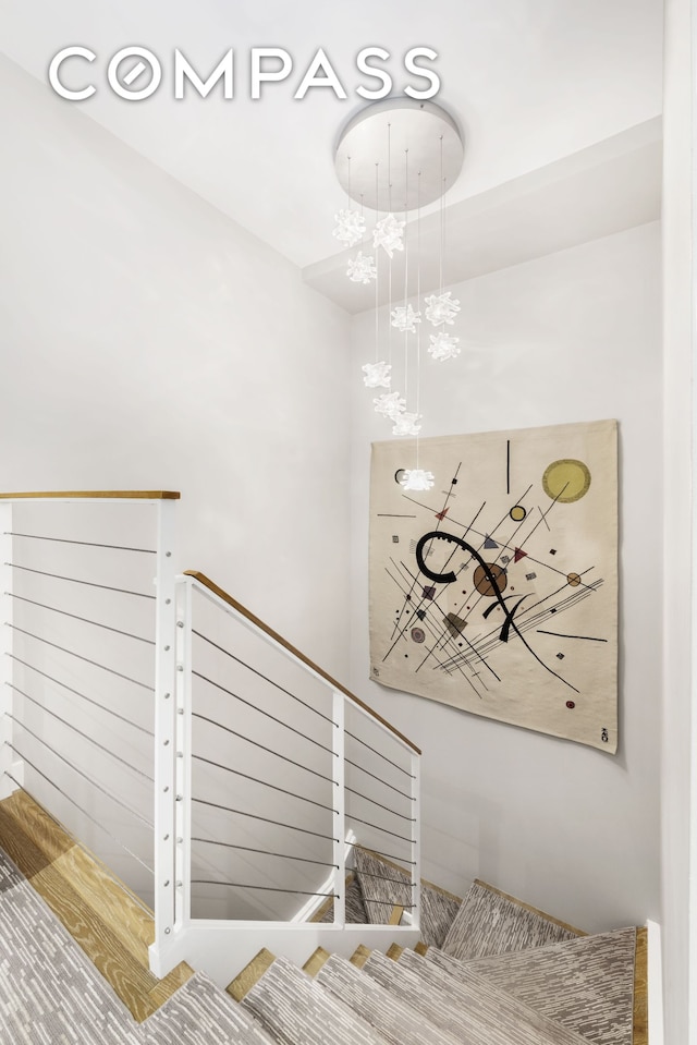 64 E 1st St Unit Th1, New York City, NY 10003 - stairs featuring a chandelier