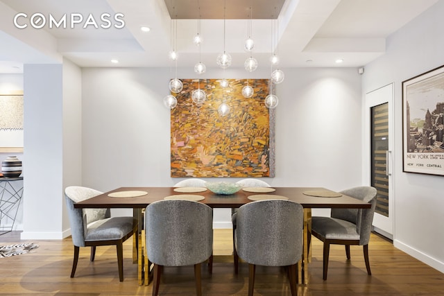 dining area with wood finished floors, recessed lighting, and baseboards