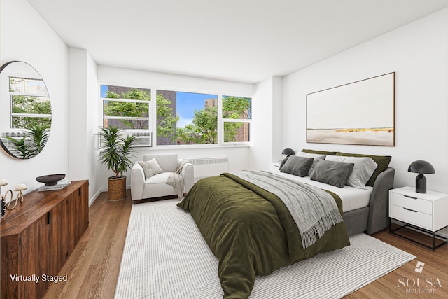 185 Park Row Unit 3F, New York City, NY 10038 - bedroom featuring wood finished floors and radiator