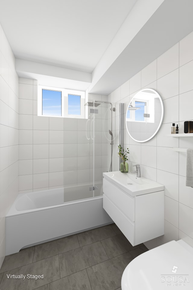 185 Park Row Unit 3F, New York City, NY 10038 - full bath with vanity, bathing tub / shower combination, tile walls, tile patterned flooring, and toilet