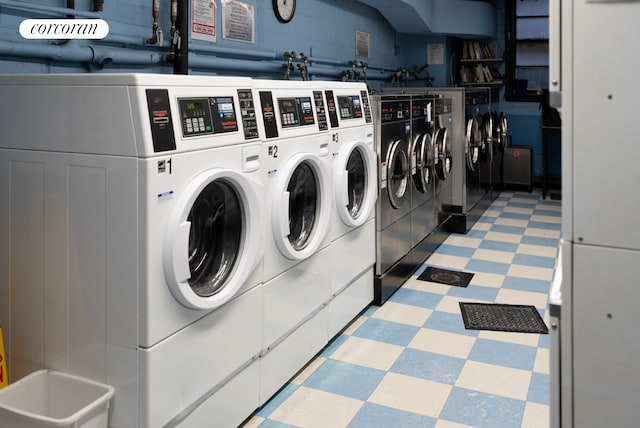 210 E 15th St Unit 1A, New York City, NY 10003 - communal laundry room featuring washer and clothes dryer and light floors