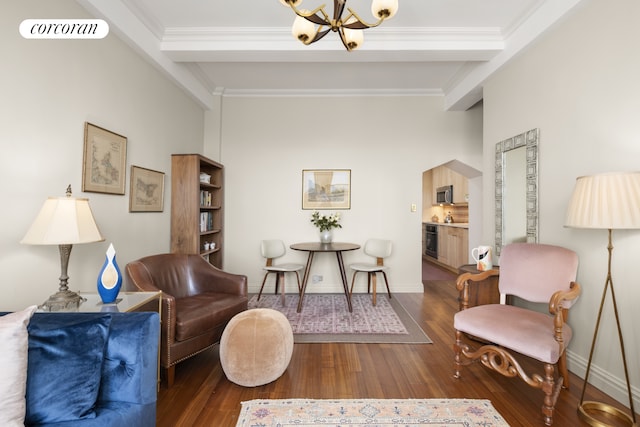sitting room featuring crown molding, wood finished floors, a chandelier, and visible vents