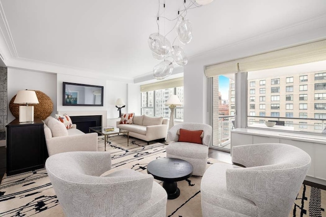 200 E 66th St Unit B1405, New York City, NY 10065 - living room with crown molding, a chandelier, and a fireplace